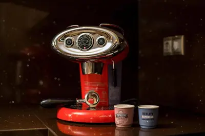 a coffee maker with two cups on a table at Anita Luxury Apartment in Rhodes Town