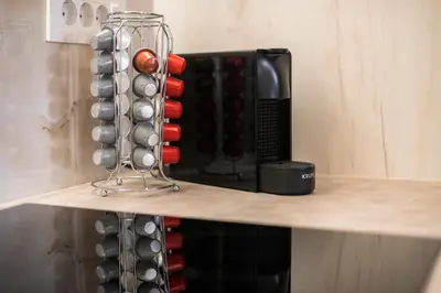 a shelf with a bunch of wine bottles at Mailo&Luke apartments in Rhodes Town