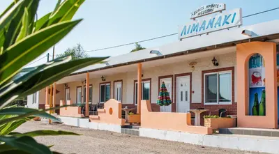 a building with a christmas tree on the facade at Limanaki Seafront Apartments in Faliraki
