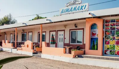 a store with a christmas tree in the window at Limanaki Seafront Apartments in Faliraki