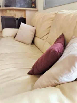 a couch with three pillows on top of it at Bellavista House in Monolithos Rhodes in Monólithos