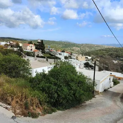 a view of a town with white buildings and trees at Bellavista House in Monolithos Rhodes in Monólithos