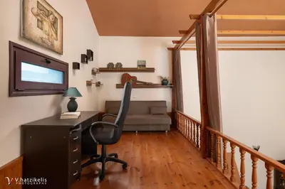 an office with a desk and a chair in a room at Ospition Villa in Apolakkiá