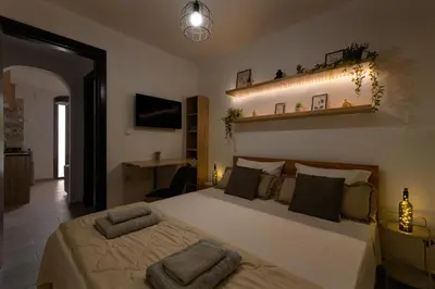 a bedroom with a large bed in a room at Parko Studios in Rhodes Town
