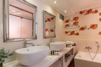 a bathroom with two sinks and a large mirror at LindosaquaView Luxury villa in Líndos