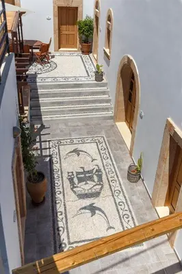 a staircase with a mosaic floor in a house at LindosaquaView Luxury villa in Líndos