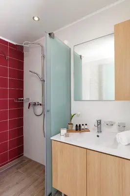a bathroom with a sink and a shower with a mirror at LindosaquaView Luxury villa in Líndos