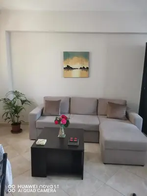a living room with a couch and a coffee table at Stella Luxury Apartment Kalathos in Kalathos