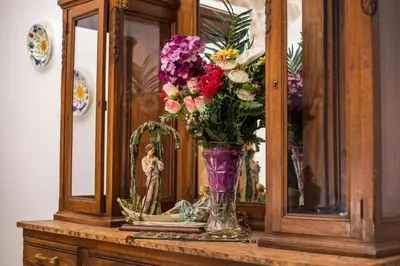 a vase filled with flowers sitting on a table at Traditional Loft Casa Di Vini in Kalithies