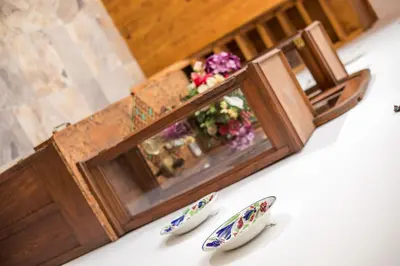 a picture frame with flowers and two pairs of shoes at Traditional Loft Casa Di Vini in Kalithies