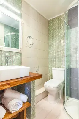 a bathroom with a sink and a toilet and a shower at Mandorla Apartments in Rhodes Town
