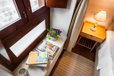 an overhead view of a small table with a lamp and flowers at Mandorla Apartments in Rhodes Town