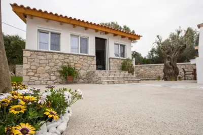 a house with flowers in front of it at CASA DI'ELEN in Faliraki