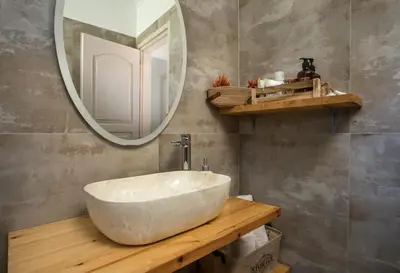 a bathroom with a large white sink and a mirror at San Francisco maisonette in Rhodes Town