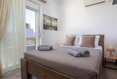 a bedroom with a bed with two pillows on it at San Francisco maisonette in Rhodes Town