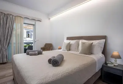 a bedroom with a large bed with towels on it at San Francisco maisonette in Rhodes Town