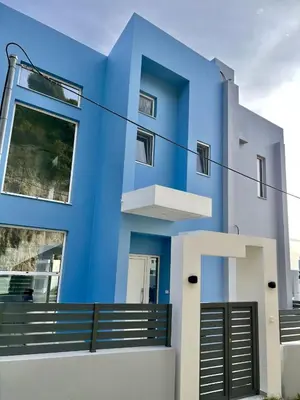 a blue facade of a house at Euphoria Blue Villa στην περιοχή Ιξιά in Rhodes Town