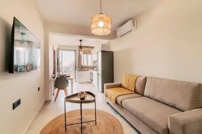 a living room with a couch and a table at Seascape House in Kremasti