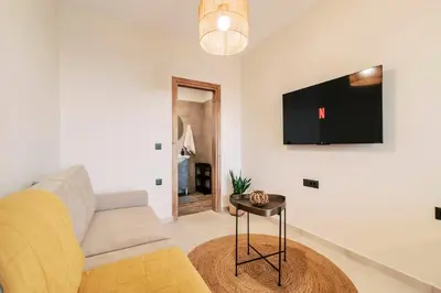 a living room with a couch and a table at Seascape House in Kremasti