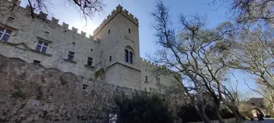 a large stone building with a tower on top of it at el greco apartment in Rhodes Town