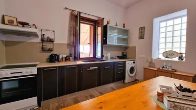 a kitchen with a sink and a stove top oven at Seva Monolithos house in Monólithos