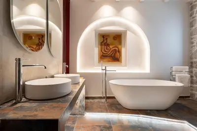 a bathroom with two sinks and a tub at Gatsby Rhodes -Two Brand New Exclusive Villas in Asgourou