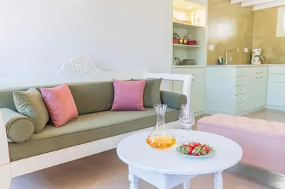 a living room with a couch and a table at LA CASA DI MARCONI in Symi