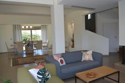 a living room with a blue couch and a table at Home21 in Asgourou