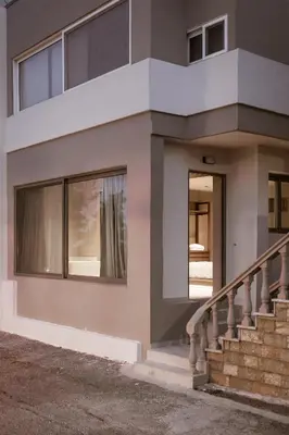 a house with a staircase in front of it at Sevasti Seaview Suite in Koskinou
