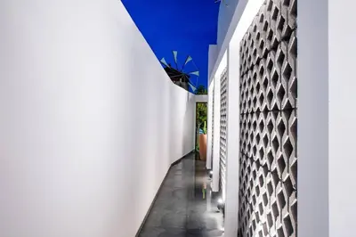 a hallway of a house with white walls at Sunwaves Beach studio II in Ialyssos