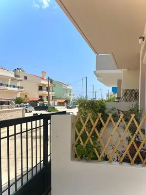 a balcony with a view of the beach at Haplotēs Rhodes Apartment in Koskinou