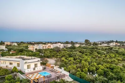 an aerial view of a house with a swimming pool at Villa Merelia in Afantou