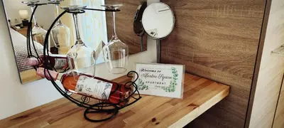 a lamp on a table with a sign on it at Afandou Square Apartment in Afantou