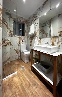 a bathroom with a sink and a toilet at Rodosrooms in Rhodes Town