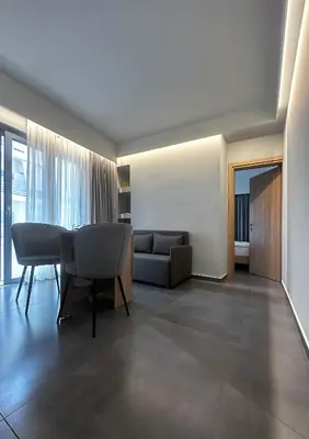 a living room with a couch and a table at Rodosrooms in Rhodes Town