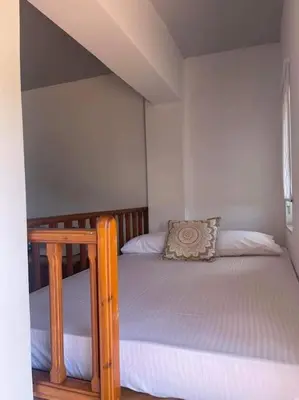 a bedroom with a bunk bed in a room at Villa Calliope Lardos in Lardos
