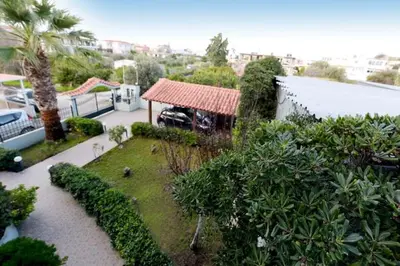 an aerial view of a house with a garden at Elli Garden View - Spacious Fully Equipped Apartment in Kremasti