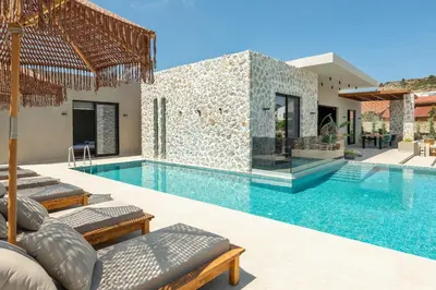 a villa with a swimming pool and a house at Mirena Luxury Living-Casa Di Ria in Afantou