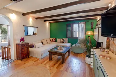 a living room with a couch and a table at Ioli's Home - Medieval Town in Rhodes Town