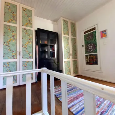 a staircase in a room with doors and windows at Ioli's Home - Medieval Town in Rhodes Town