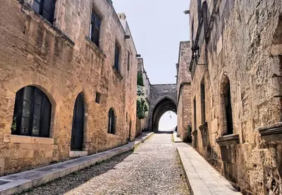 an alley in an old building with a tunnel at Ioli's Home - Medieval Town in Rhodes Town
