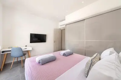 a bedroom with a bed with two pillows on it at Villa Odysseas in Ialyssos