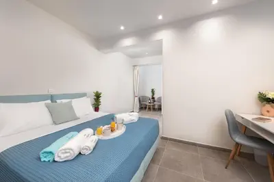 a bedroom with a bed with towels on it at Villa Odysseas in Ialyssos