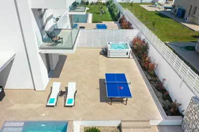an overhead view of a patio with a table and chairs at Villa Odysseas in Ialyssos