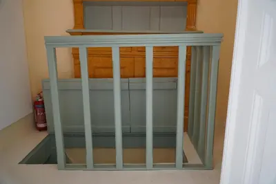 a cage in the corner of a room at Say Yes Symi House in Symi