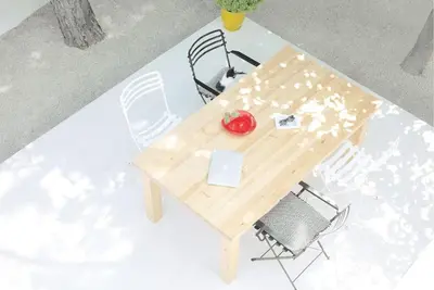 a table with a laptop and a red apple on it at White dream summer house in Ialyssos