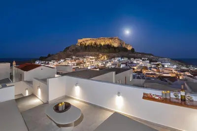 a view of the city from the roof of a house at Noema Lindos - Athena Apartment in Líndos
