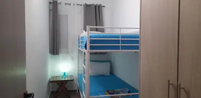 a room with two bunk beds and a lamp at A&J Apartments in Gennadi