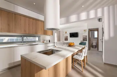 a kitchen with a sink and a counter top at Martini Villas in Kremasti