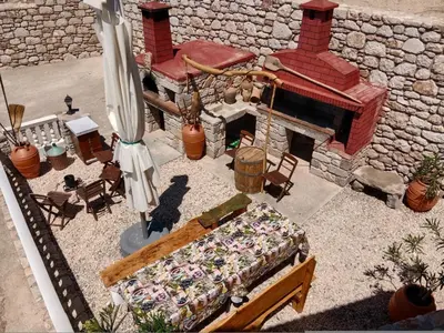 a model of a stone building with a fireplace at Tsampika's Traditional Stone Cottage in Siana in Siána